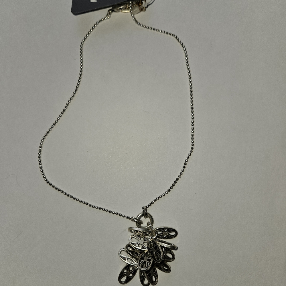 Pilgrim silvertone necklace with a lit of little pendants on it, NWT